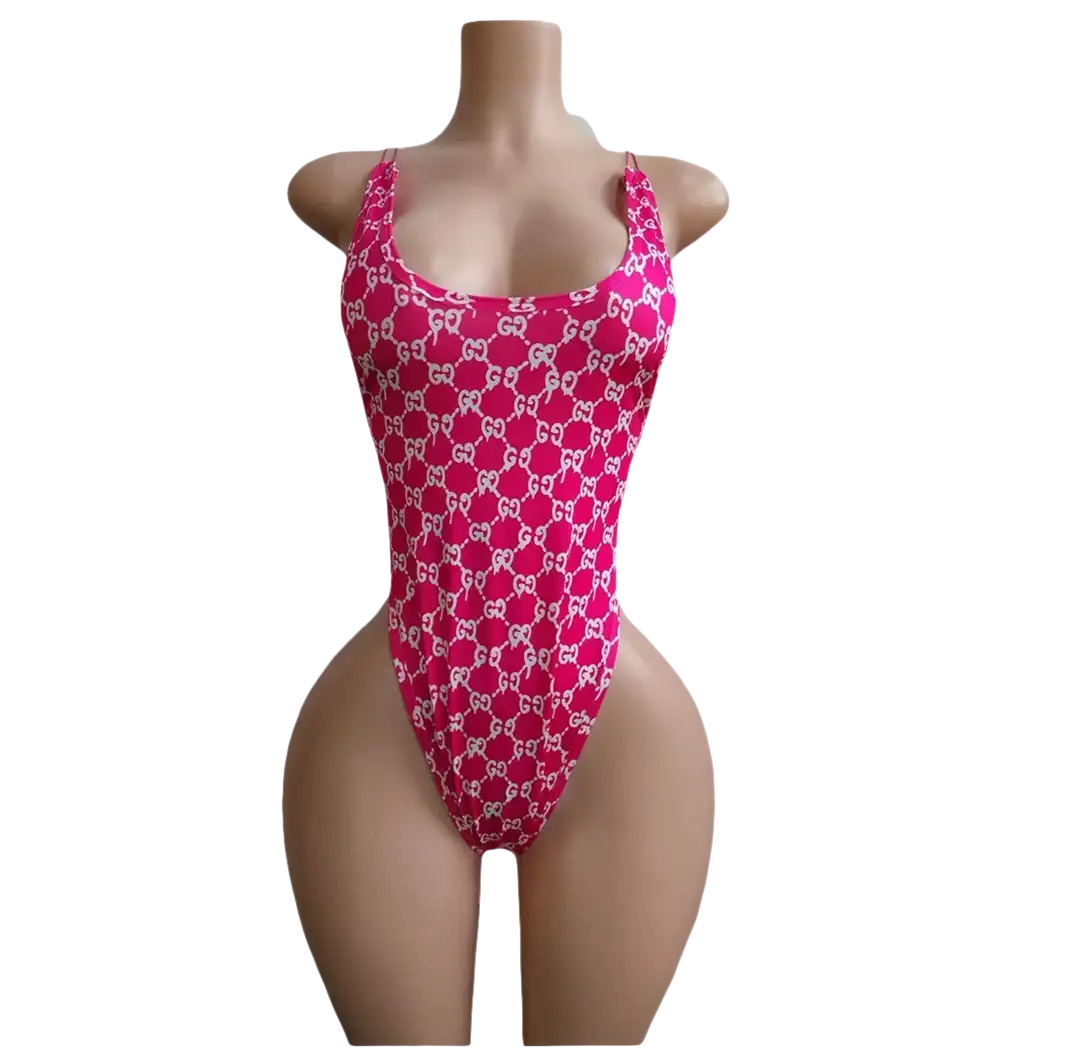 Pink Gucci-patterned one-piece swimsuit.