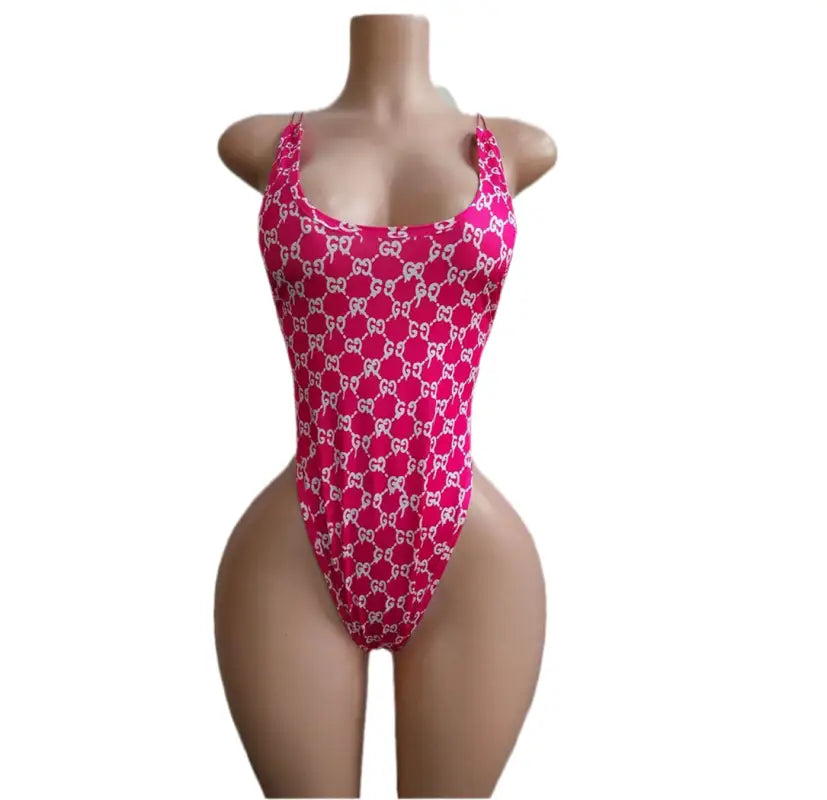 Pink Gucci-patterned one-piece swimsuit.