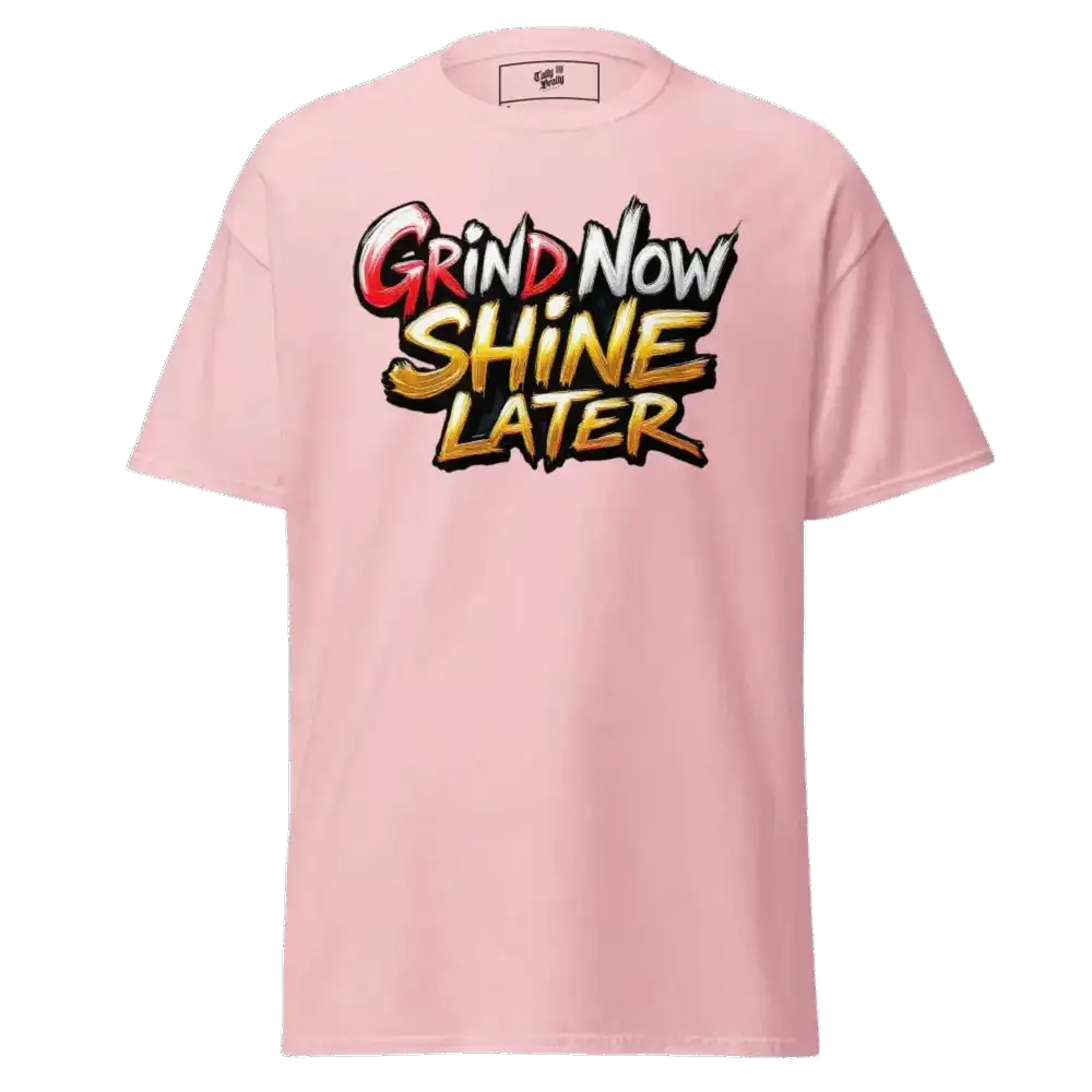 Pink t-shirt with ’Grind Now Shine Later’ graphic.