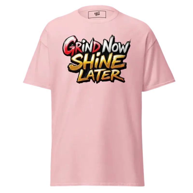 Pink t-shirt with ’Grind Now Shine Later’ graphic.