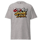 Gray t-shirt with ’Grind Now Shine Later’ graphic.