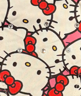 Hello kitty fabric with rhinestones and red bows.