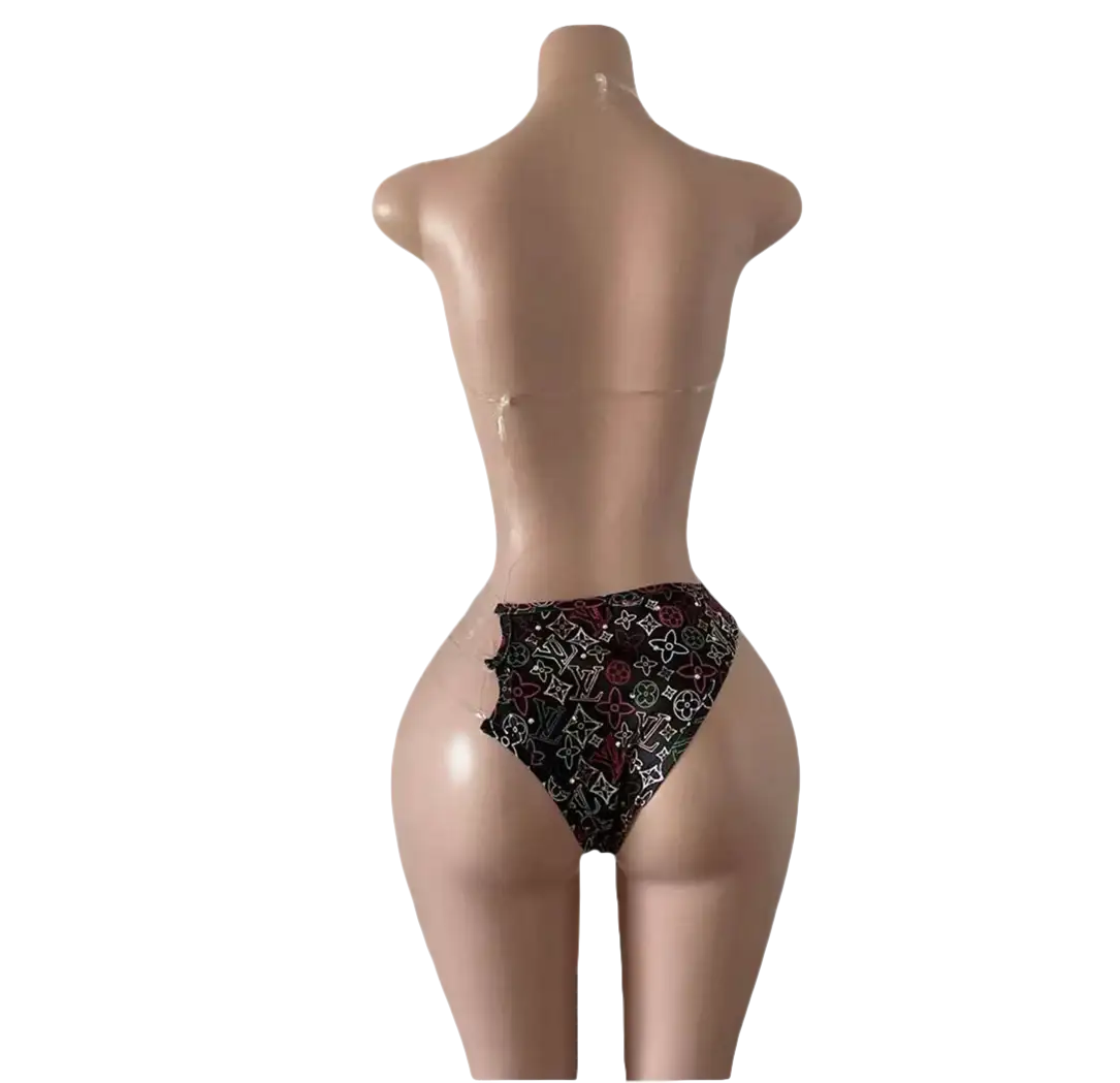 Mannequin wearing a patterned bikini.