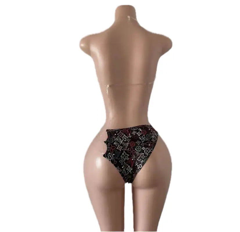 Mannequin wearing a patterned bikini.