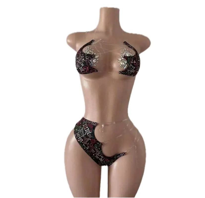 Mannequin wearing a black and silver bikini.