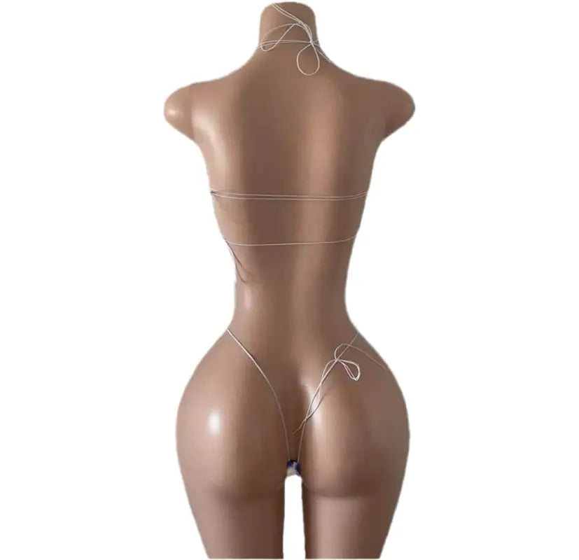 Minimalist string bikini on mannequin.