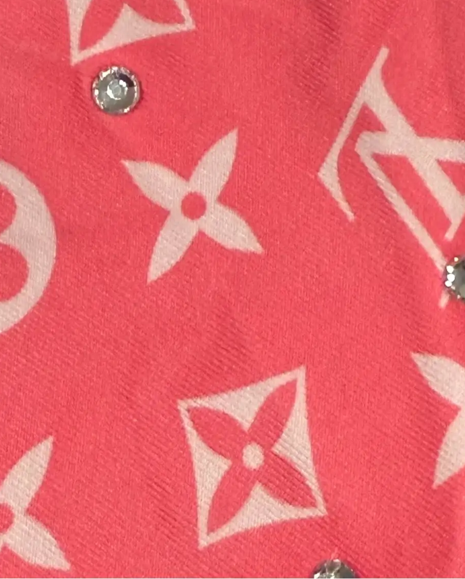 Pink louis vuitton bandana with white monogram pattern and rhinestones.