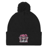 Black beanie with pompom and cartoon graphic.
