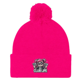 Bright pink beanie with pompom.
