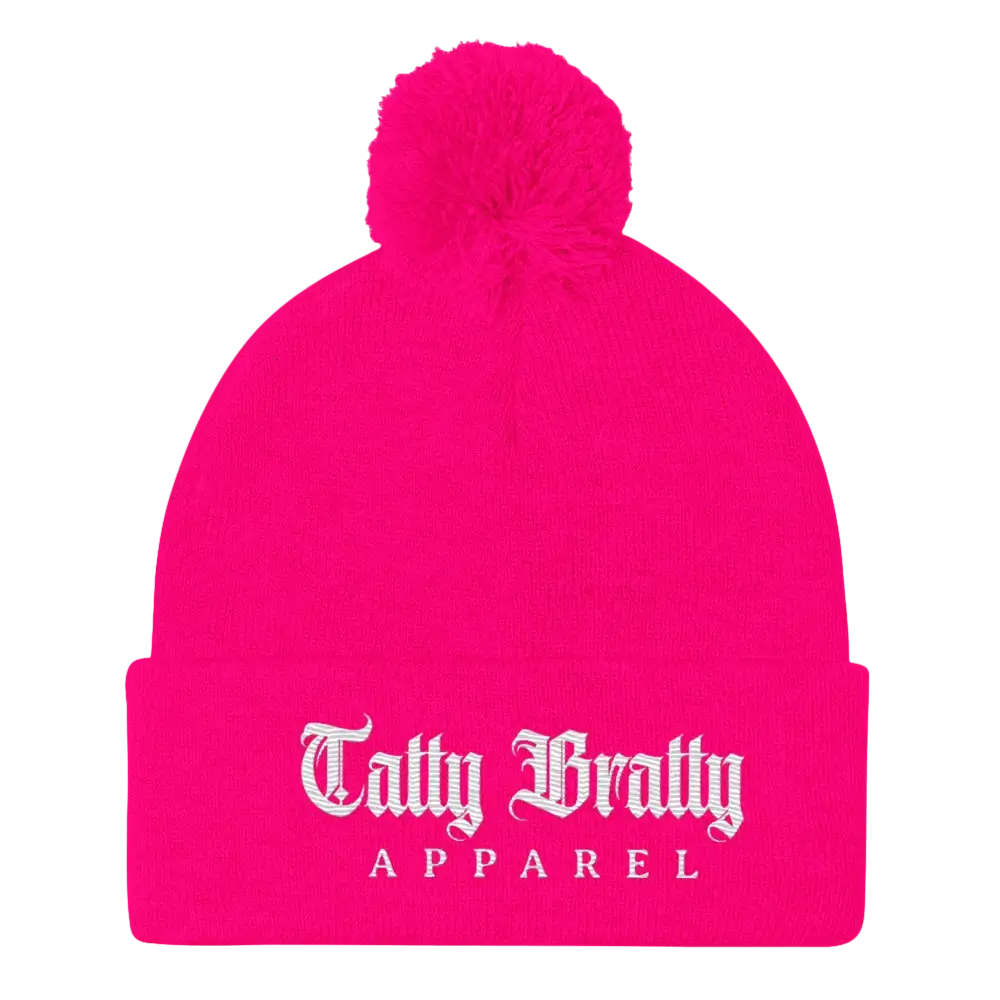 Hot pink beanie with pompom.