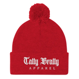 Red knit beanie with pompom.