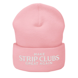 Pink beanie with embroidered text.