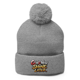 Gray knit beanie with pompom.
