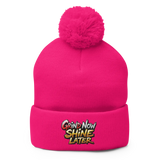 Pink pom-pom beanie.