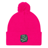 Bright pink beanie with pompom.