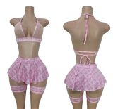 Pink halter top and pleated skirt set.