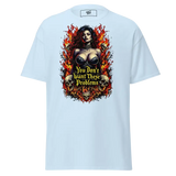 Light blue t-shirt with a woman, skulls, and flames graphic.
