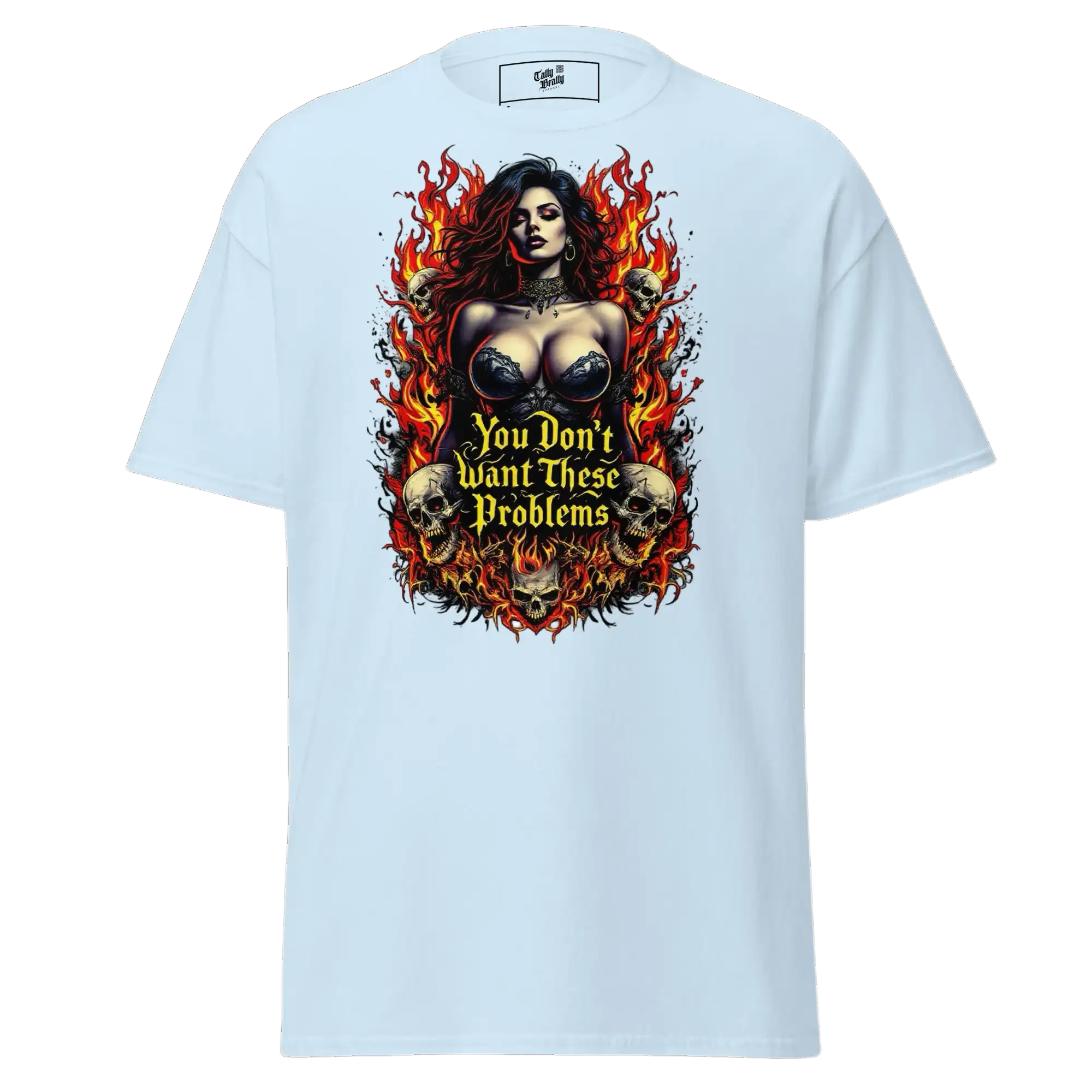 Light blue t-shirt with a woman, skulls, and flames graphic.